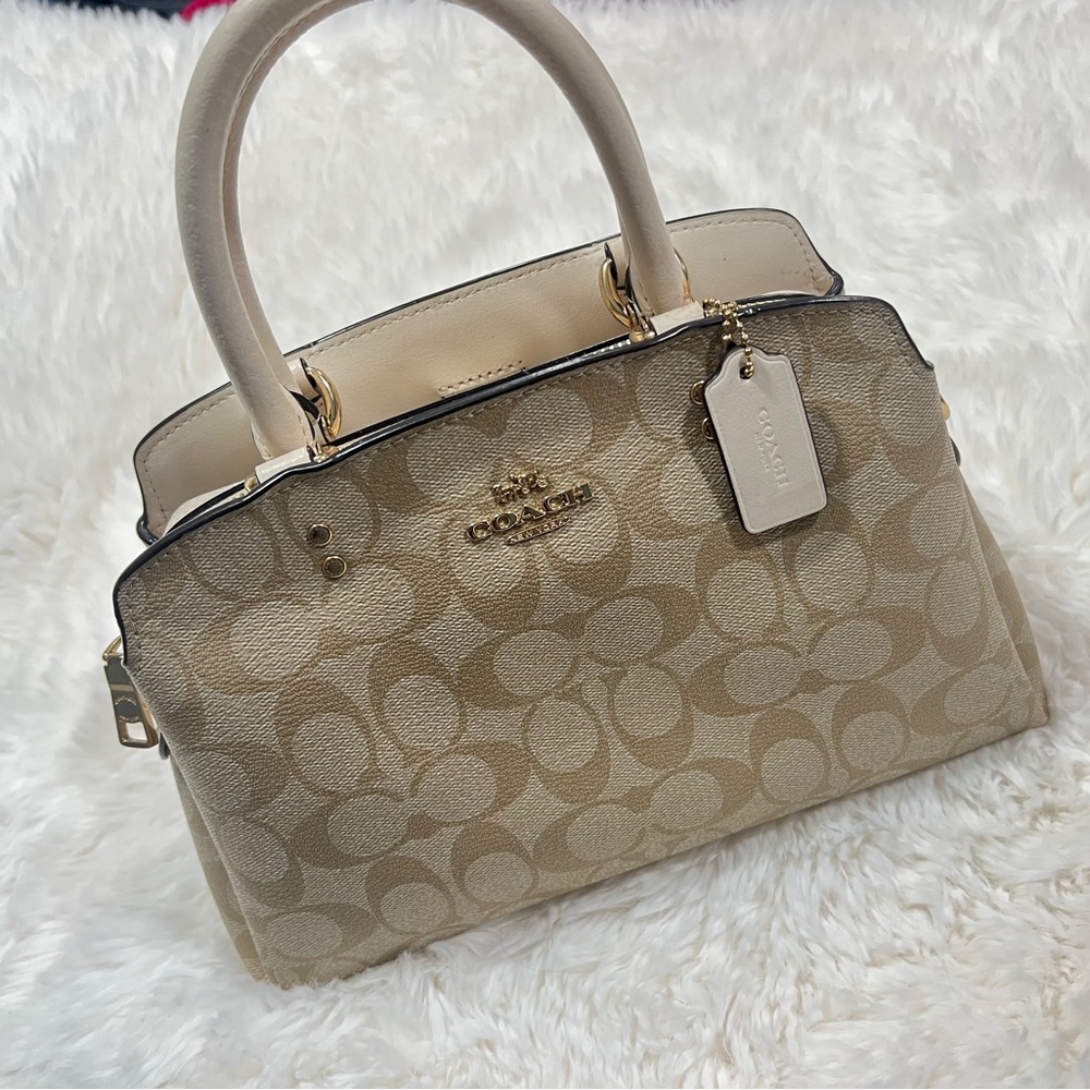 white and light brown coach purse